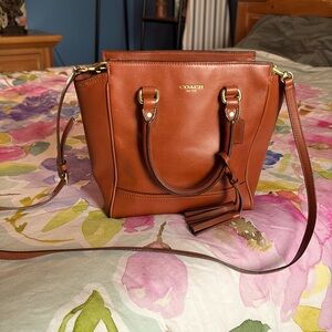 Beautiful soft brown leather Coach bag that has both a should and hand straps.
